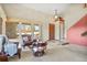 Comfortable living room with large windows, plush seating, and a warm ambiance at 6279 Cheyenne Ct, Parker, CO 80134