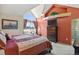 The main bedroom offers a vaulted ceiling, large window and decorative shelving at 6279 Cheyenne Ct, Parker, CO 80134