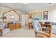 The home office is furnished with a sitting area and desk at 6279 Cheyenne Ct, Parker, CO 80134