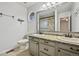 Bathroom featuring dual sinks, granite countertops, and an enclosed glass shower at 723 Eaton Rd, Palmer Lake, CO 80133