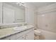 Bathroom with a single sink vanity with granite countertop and a shower and tub combo at 723 Eaton Rd, Palmer Lake, CO 80133