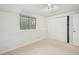 Bedroom offering neutral carpet, a large window, and a large closet for storage at 723 Eaton Rd, Palmer Lake, CO 80133