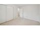 Clean bedroom with plush carpeting, fresh white paint, and a door leading to bath at 723 Eaton Rd, Palmer Lake, CO 80133