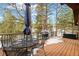 Enjoy outdoor dining on this spacious deck with metal furniture and a natural gas grill at 723 Eaton Rd, Palmer Lake, CO 80133