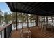 Outdoor deck provides ample room for entertaining with forest views and outdoor furniture at 723 Eaton Rd, Palmer Lake, CO 80133