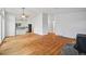 Spacious living room featuring hardwood floors, modern lighting and an open floor plan to the kitchen at 723 Eaton Rd, Palmer Lake, CO 80133