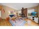 Open living room with wood burning stove and hardwood floors at 723 Eaton Rd, Palmer Lake, CO 80133