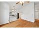 Hardwood floors connect the dining area and kitchen of this light-filled home at 723 Eaton Rd, Palmer Lake, CO 80133