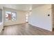 Bright living space with large windows offering views of the neighborhood at 10341 E 62Nd Pl, Denver, CO 80238