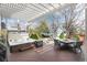 Inviting backyard featuring a pergola, hot tub, dining area, and lush landscaping at 479 Blue Lake Trl, Lafayette, CO 80026