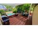 Inviting backyard deck with hot tub, dining set, and lush landscaping, perfect for relaxation and entertaining at 479 Blue Lake Trl, Lafayette, CO 80026