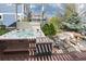 Relaxing backyard space with a hot tub, decorative stone, and manicured shrubs at 479 Blue Lake Trl, Lafayette, CO 80026