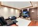 Finished basement featuring a large TV, comfortable seating, and a warm, inviting atmosphere at 479 Blue Lake Trl, Lafayette, CO 80026