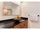 Stylish bathroom featuring a vessel sink, granite countertop, and walk-in shower at 479 Blue Lake Trl, Lafayette, CO 80026