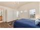 Spacious bedroom featuring wood floors, ample closet space, and bright natural light at 479 Blue Lake Trl, Lafayette, CO 80026