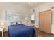 Bright bedroom with a chandelier, wood floors, and plenty of natural light at 479 Blue Lake Trl, Lafayette, CO 80026