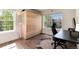 Bedroom with a desk space, large windows, and natural light at 479 Blue Lake Trl, Lafayette, CO 80026