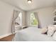 Cozy bedroom with wood floors, large windows, and comfortable furnishings at 479 Blue Lake Trl, Lafayette, CO 80026
