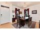 Elegant dining room with stylish chandelier, hardwood floors, and sophisticated decor at 479 Blue Lake Trl, Lafayette, CO 80026