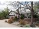 Charming home exterior featuring a pergola, a manicured lawn, and a detached garage at 479 Blue Lake Trl, Lafayette, CO 80026
