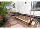 Exterior side view with raised garden beds and stone walkway at 479 Blue Lake Trl, Lafayette, CO 80026