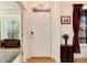 Bright foyer with hardwood floors, chandelier, and a view into the living space at 479 Blue Lake Trl, Lafayette, CO 80026