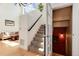 Inviting foyer featuring soaring ceilings, staircase, and views of the living area at 479 Blue Lake Trl, Lafayette, CO 80026