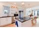 Kitchen featuring granite countertops, stainless steel appliances, and seamless flow into the adjacent living spaces at 479 Blue Lake Trl, Lafayette, CO 80026