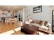 Open-concept floor plan featuring a light-filled living room connecting seamlessly to the kitchen and dining area at 479 Blue Lake Trl, Lafayette, CO 80026