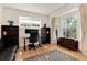 Bright home office with bay window, built-in shelves, and ample natural light at 479 Blue Lake Trl, Lafayette, CO 80026