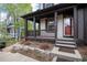 Cozy front porch with decorative columns and a view of the landscaped yard at 479 Blue Lake Trl, Lafayette, CO 80026