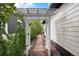 A beautiful walkway that features a trellis connecting two parts of the home at 479 Blue Lake Trl, Lafayette, CO 80026