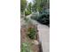 Charming walkway lined with landscaping and decorative accents at 479 Blue Lake Trl, Lafayette, CO 80026