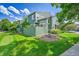 This property has a green backyard with a wooden fence and a small landscape area at 1229 James Cir # 1, Lafayette, CO 80026