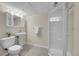 Bright bathroom features vanity sink, toilet, and glass enclosed shower stall at 1229 James Cir # 1, Lafayette, CO 80026