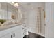 Stylish bathroom featuring modern vanity, countertop, mirror, and subway tile in the shower at 1229 James Cir # 1, Lafayette, CO 80026