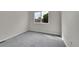 Bright, empty bedroom with ample light and neutral carpet at 1229 James Cir # 1, Lafayette, CO 80026