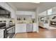 Open-concept kitchen with stainless steel appliances and bright, airy living space at 1229 James Cir # 1, Lafayette, CO 80026