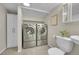 Updated laundry room with modern appliances and ample storage and adjacent toilet at 1229 James Cir # 1, Lafayette, CO 80026