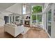Inviting living room showcasing vaulted ceilings, fireplace and large windows at 1229 James Cir # 1, Lafayette, CO 80026