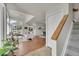 Bright, open-concept living space with hardwood floors, staircase, and seamless flow at 1229 James Cir # 1, Lafayette, CO 80026