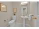 Classic half-bath with pedestal sink and decorative accents at 1229 James Cir # 1, Lafayette, CO 80026