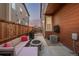 Cozy backyard patio with a fire pit, outdoor seating, and a grill at 13860 Ash Cir, Thornton, CO 80602