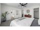 Bright bedroom with cozy decor, plush carpeting, ensuite bathroom, and walk-in closet at 13860 Ash Cir, Thornton, CO 80602