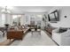 Cozy living room with a large leather sectional sofa, modern decor, and natural light at 13860 Ash Cir, Thornton, CO 80602