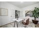 Well-lit office featuring a white desk, modern chair, and serene decor elements at 13860 Ash Cir, Thornton, CO 80602