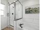 Modern bathroom showcasing a glass-enclosed shower, soaking tub, and luxury finishes at 13860 Ash Cir, Thornton, CO 80602