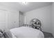 Simply decorated bedroom featuring a black metal bed frame and white bedding at 13860 Ash Cir, Thornton, CO 80602