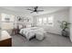 Cozy bedroom with a ceiling fan, soft carpet, and an abundance of natural light at 13860 Ash Cir, Thornton, CO 80602