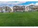 Attractive home exterior with green lawn, showcasing the facade and neighborhood setting at 13860 Ash Cir, Thornton, CO 80602